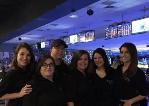 Alicia Linklater featured in group photo at bowl for kid's sake - big brothers and big sisters