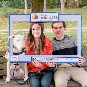 couple featured with dog in photo for client appreciation event - october 2018